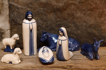 Blue and white ceramic nativity set with Holy Family Mary Jesus and Joseph in Bethlehem stable on...