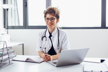 Young female doctor at doctor’s office. Portrait of female doctor.