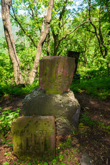 An old khachkar (cross-stone) situated in the forest, Armenia