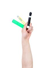 Man's arm raised holding a office supplies: markers. Isolate on white background.