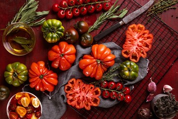 Ox heart tomatoes, on rustic wood background