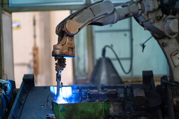 Robot arms machine in intelligent factory industrial on monitoring system software. Welding robotics and digital manufacturing operation.