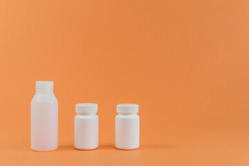 Set of plastic bottles on orange background. Recycling concept and environment.
