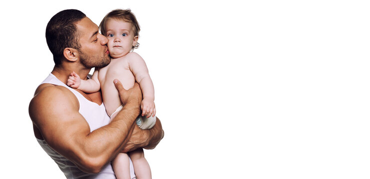 Athletic father holding on strong muscular hands infant daughter
