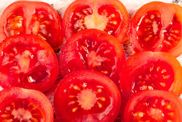 Close-up of a bowl full of fresh cherrys tomatoes. Tomatoes texture concept, fresh summer food