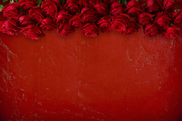 Antique red wall and roses texture background