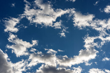 Beautiful clouds on a background of blue sky