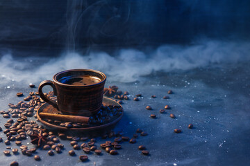 clay cup of coffee and roasted coffee beans, cinnamon stick and anise, dark smoky background. Coffee banner for coffee shops