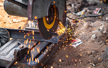 closeup of circular grinder cutting iron