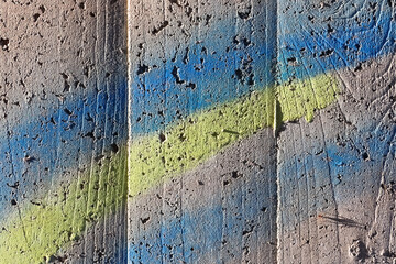 Detailed view on colorful aged concrete walls from different modern and historical buildings with...
