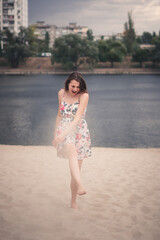 girl on the beach playing with sand