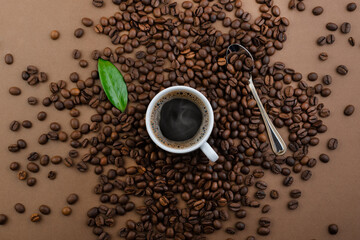 Coffee cup and beans, top view with copyspace for text