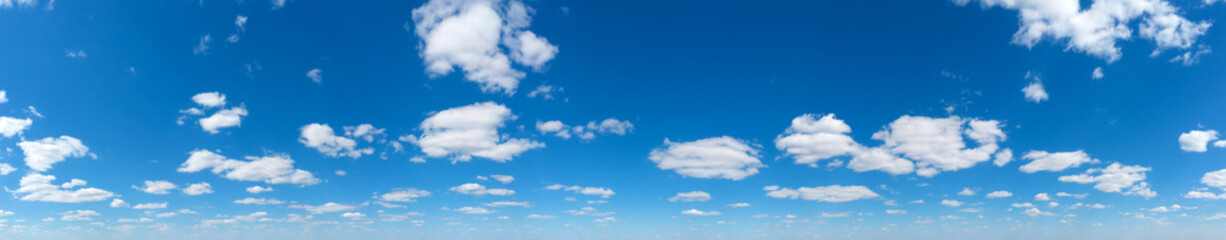 Obraz premium Panoramic fluffy cloud in the blue sky. Sky with cloud on a sunny day.