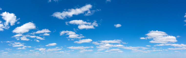 Naklejka na ściany i meble Panoramic fluffy cloud in the blue sky. Sky with cloud on a sunny day.