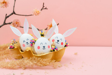 Easter background with eggs on pink background