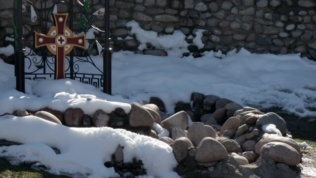 Pilgrimage Christian Center. On the background of the cross, stones and snow
