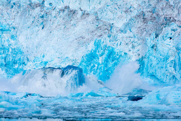 USA, Alaska, Massive underwater iceberg erupts from beneath ocean surface at face of LeConte Glacier east of Petersburg