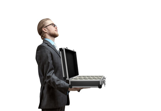 businessman holds suitcase with cash dollars