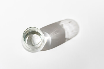 the simple abstract still water with a harsh shadow on the table