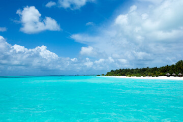 tropical Maldives island with white sandy beach and sea