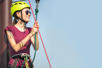 Having fun in rope park. Young woman in rope park
