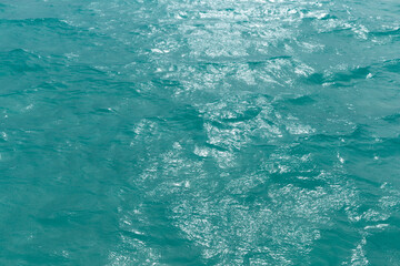 Blue  water with sun reflections