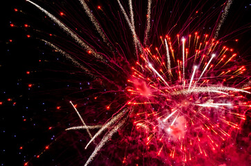 Fototapeta na wymiar festive fireworks in the night black sky