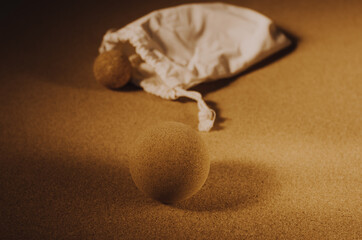 Close up of fascia release cork massage ball a cork mat background, warm golden light. Concept: eco friendly and sustainable self care tools, props.