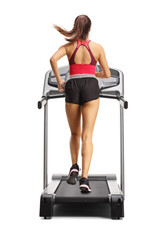 Full length rear shot of a fit female running on a treadmill