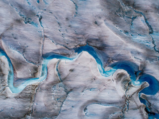 USA, Alaska, Tracy Arm-Fords Terror Wilderness, Overhead aerial view of meltwater streams and ponds on crevassed surface of Sawyer Glacier in Tracy Arm