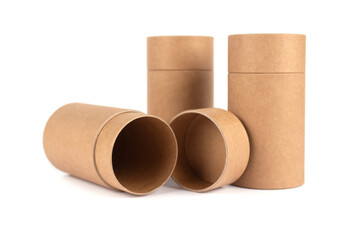 Open and closed paper tubes, cardboard containers with paper caps for cosmetic packaging isolated on white background, mockup. Selective focus