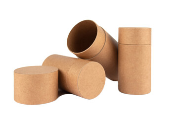 Different types of recyclable paper tubes, cardboard containers with paper caps for cosmetic or other packaging isolated on white background, mockup. Eco-friendly packaging concept. Selective focus