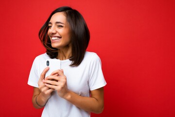 Photo shot of attractive positive happy smiling good looking young brunette woman wearing casual...