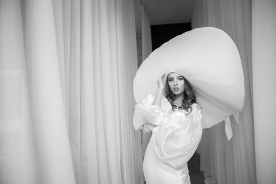 Young Woman In Large Wide Brimmed Hat