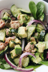 Healthy food. Cucumber tuna avocado salad. 