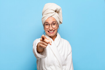 senior pretty woman after shower wearing bathrobe
