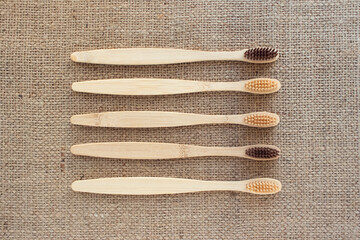 Mockup image, set of natural bamboo toothbrushes on rustic background with copy space. Sustainable...