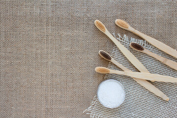 Bathroom essentials in zero waste home - bamboo toothbrushes and kaolin dentifrice, tooth powder...