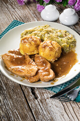 Stewed turkey meat in gravy.