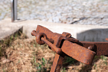 a rusty screw ring at an old plough