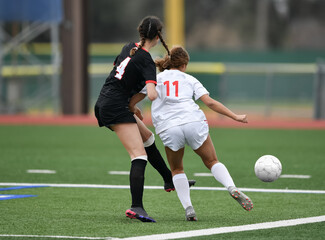 High school girls competing in a soccer match in south Texas