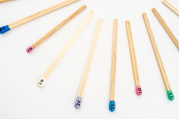 matchsticks with faces painted on the heads