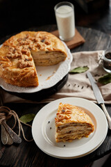 Kurnik is a national Russian dish, Pie made of pancakes, chicken, mushrooms and puff pastry. © Savory