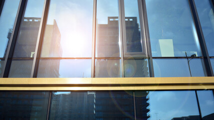 Fragment of glass and metal facade walls. Commercial office buildings. Abstract modern business architecture.
