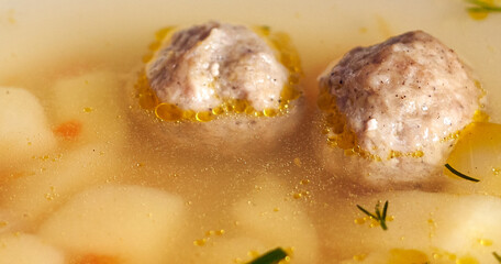meatball soup poured into a plate