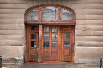 Fototapeta premium Facade old stone wall with door gate