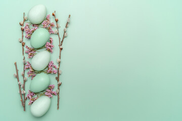 Creative flat lay photo of easter eggs on colorful background.