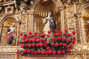Virgin Mary surrounded by roses