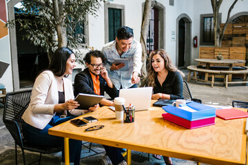 Group of latin young people in smart casual wear having a brainstorm meeting while sitting in office and New business development, Startup concept in Latin America