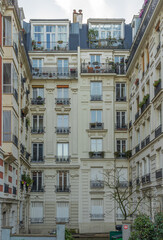 Paris, France - 02 26 2021: Montmartre district. Building facade with balconies